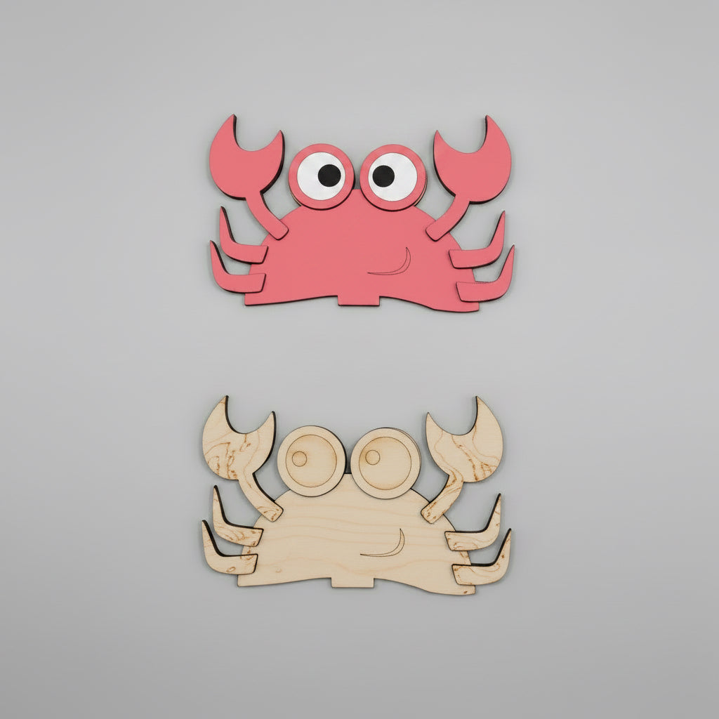 Two crab-shaped MDF cutouts, one red and one unpainted