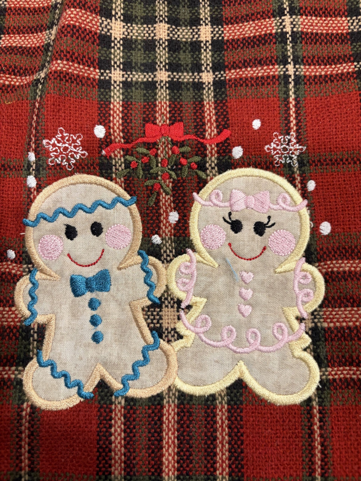 Gingerbread Tree skirt with a Christmas plaid background and green satin ruffle.