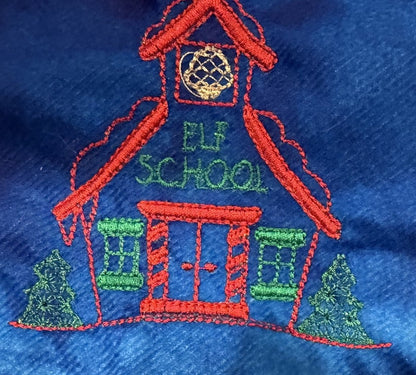 Northpole Village tree skirt with a sketch style embroidery on a blue background.