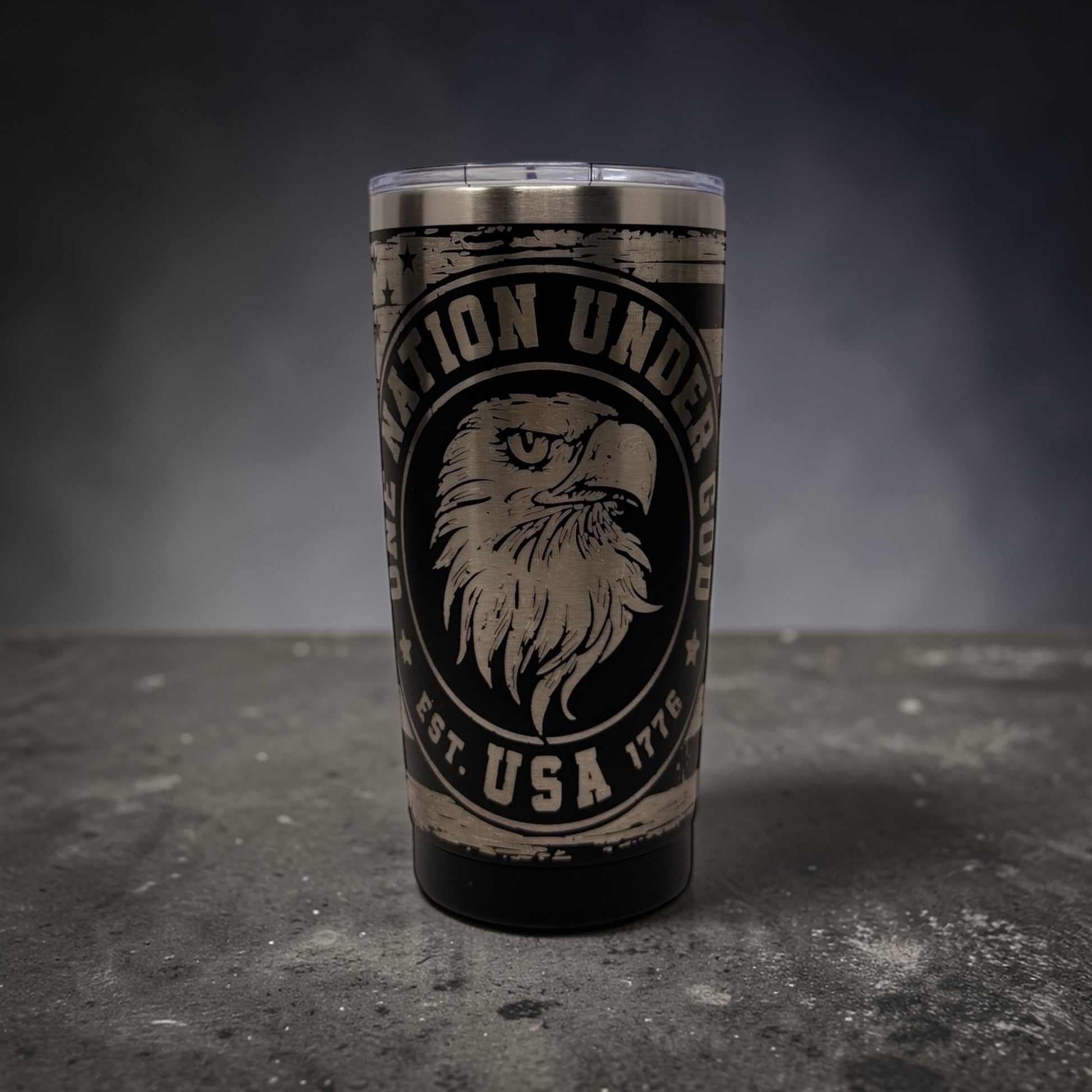 Tumbler with an eagle design and text "One Nation Under God USA Est 1776"