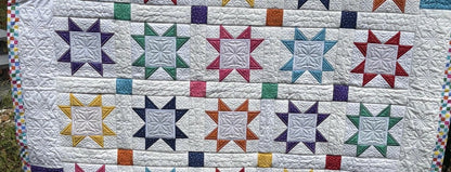 Prairie Star Quilt with intricate embroidery highlights