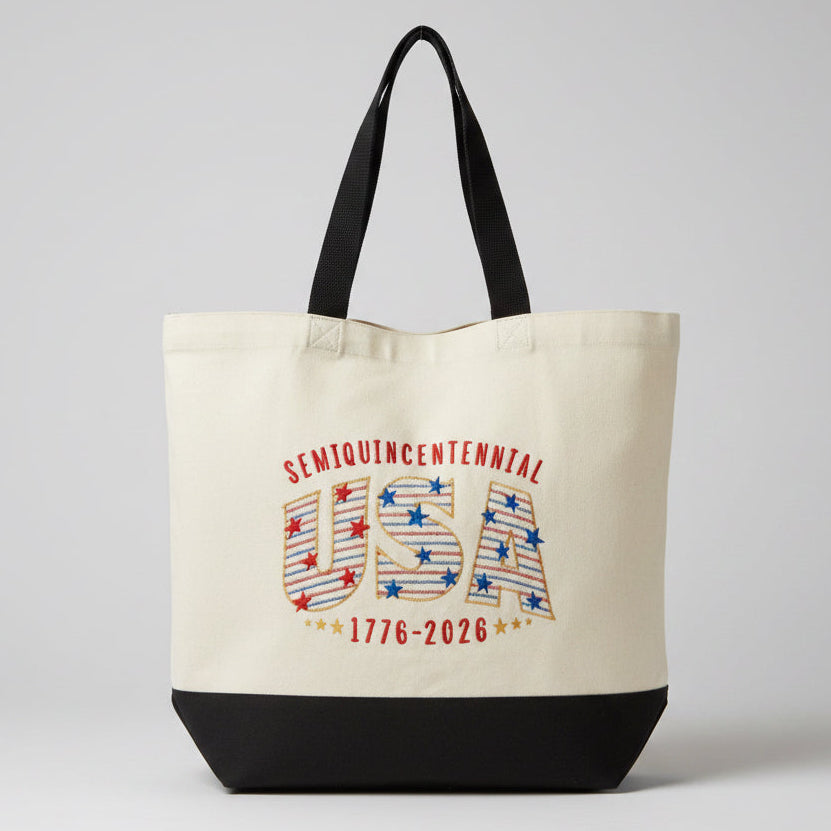 Tote bag with 'Semiquincenial USA 1776-2026' design on a window blind background