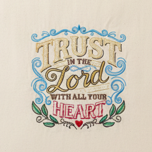 Tote bag with 'Trust in the Lord with all your heart' text on a gray background