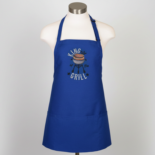 Blue apron with 'King of the Grill' graphic on a mannequin against a white background