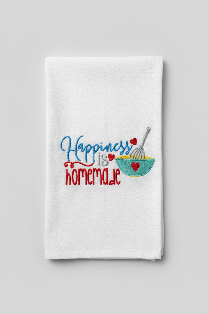 Embroidered towel with 'Homemade Happiness' text and pie design.