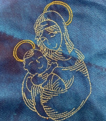 Nativity tree skirt with a blue background.