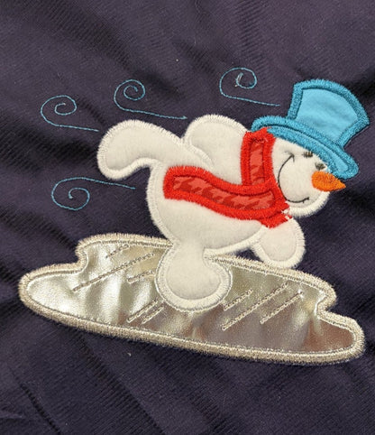 Snowmen tree skirt with applique embroidery on a blue background.