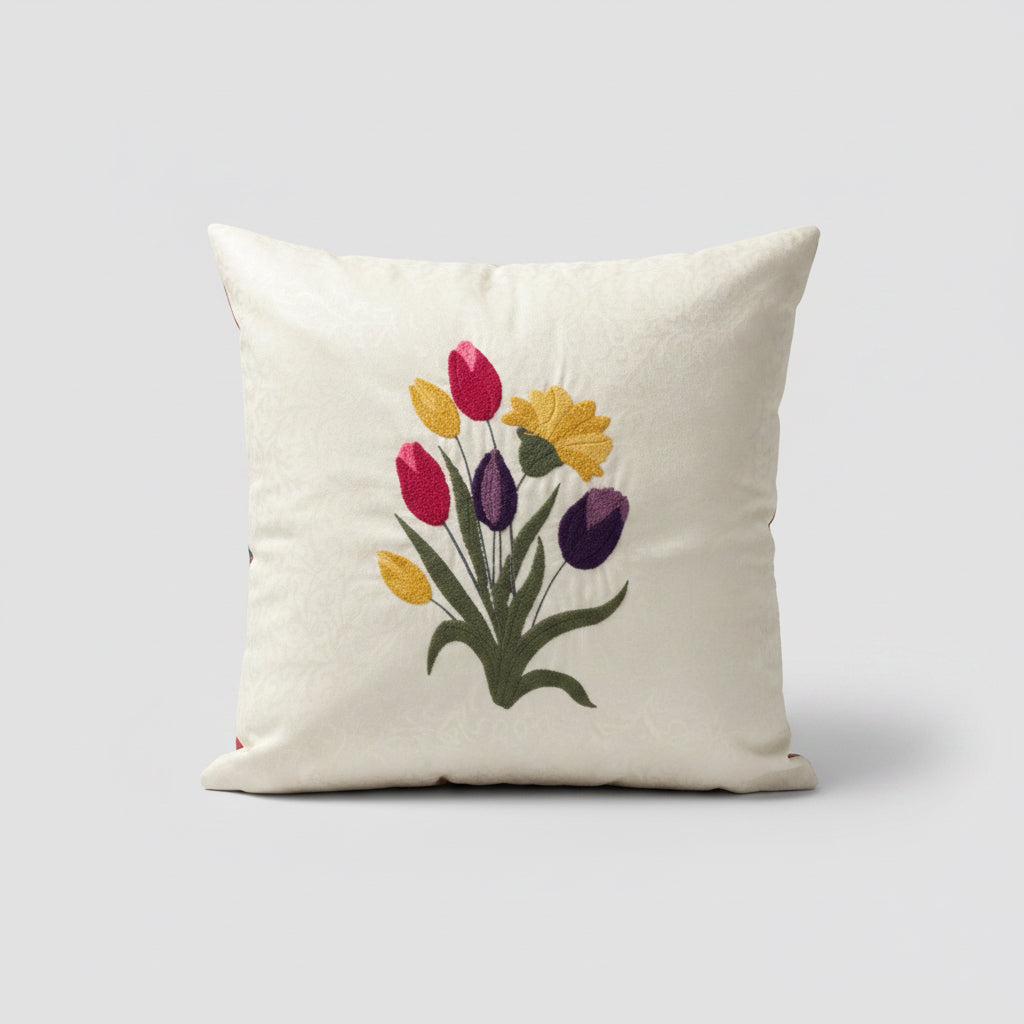 Decorative pillow with embroidered tulips on a patterned chair