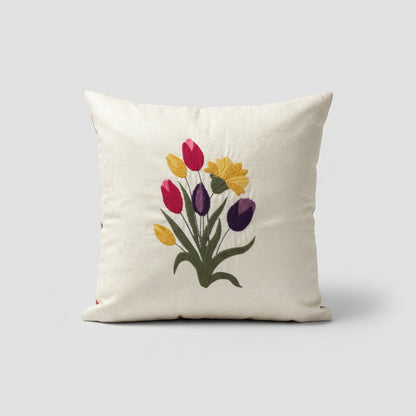 Decorative pillow with embroidered tulips on a patterned chair
